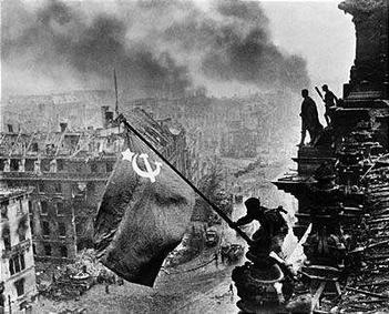 Raising a Flag over the Reichstag - Yevgeny Khaldei (1945)
